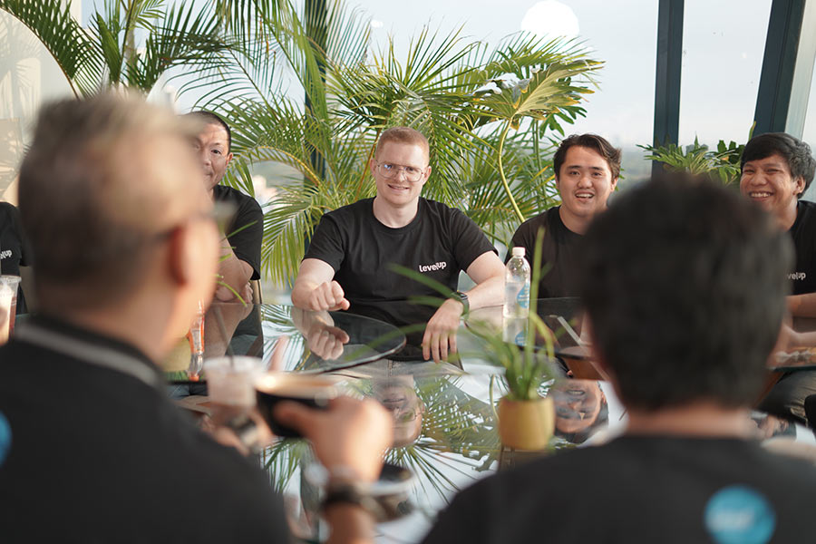 LevelUp team gathered around an outdoor table
